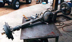 The rear axle removed and being made ready for new perches. Click for a larger image!