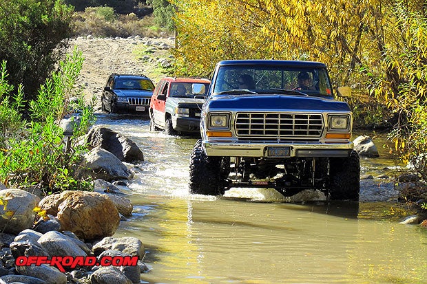 4-Wheel Drive truck and Sport Utilities crossing stream in the San Gabriel Mountains, CA.