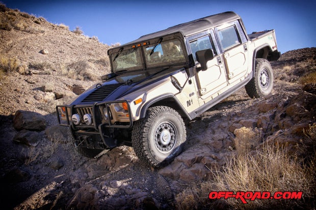Rod Hall in his H1 Alpha Hummer driving off-road in the Nevada desert.