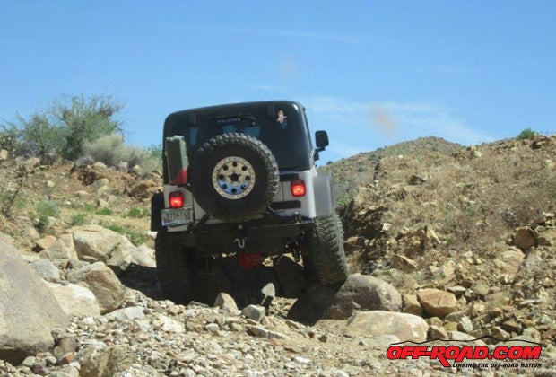 With darkened windows, the black side bags and black enclosure are invisible, even while following the Jeep on a trail.
