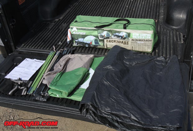 Napiers Sportz truck tent comes with everything to set up sleeping quarters in the bed of a truck. Aside from the tent itself (bottom right), the kit comes with color-coded fiberglass poles, a rain fly, instructions and a carrying bag. 