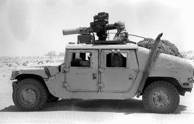 Military Humvee featuring a snorkel intake and snorkel exhaust system.