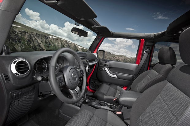 The interior received updates on the 2011 Wrangler, and overall the integration of technology and an ergonomically friendly design made the 2012 Jeep Wrangler a fun drive on and off road. Photo Courtesy of Chrysler