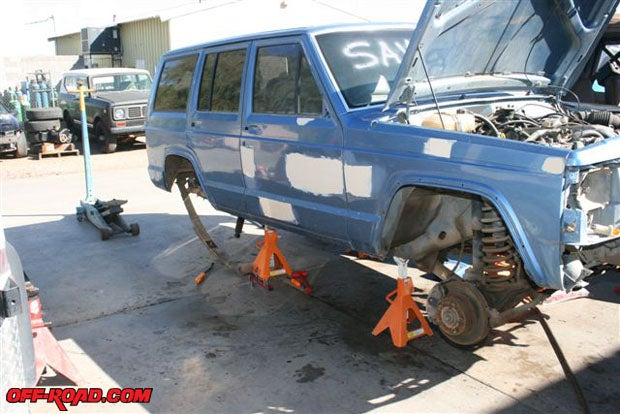 Always support your Jeep safely. The rear differential is removed, and the rear leaf springs are partially removed.