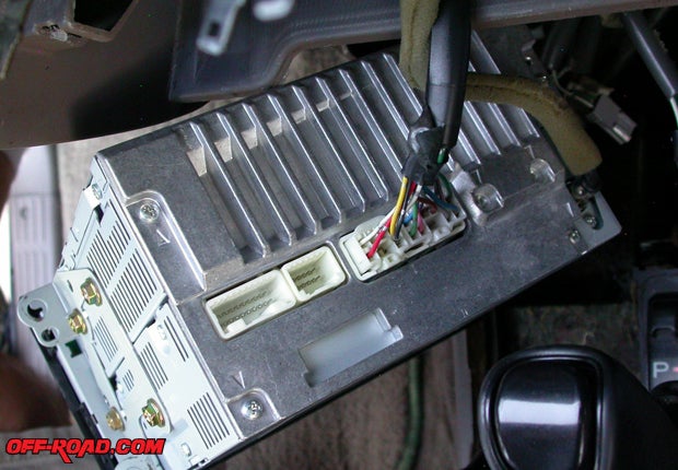 Of two female plugs in the back of the T1807, the Scosche iPod controller only requires one and will let you bridge into the satellite connection without interfering.