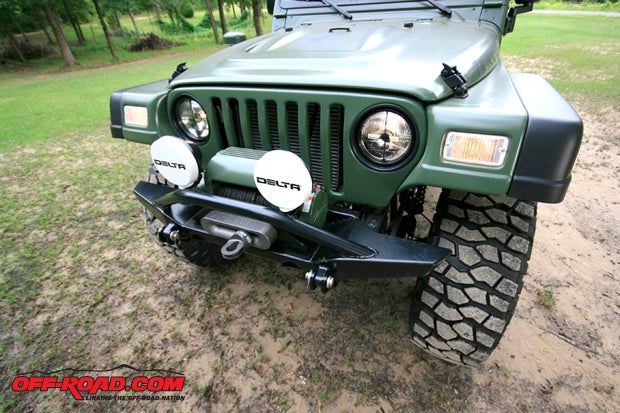The Hanson bumper hosts a Ramsey Patriot 9500 winch. X-Line synthetic rope and aluminum fairlead complete the winch. Delta Tech HID headlights, driving lights and bumper lights put out huge candlepower.