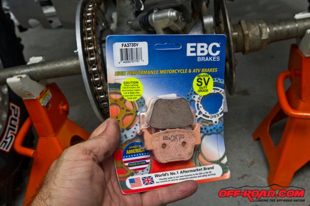 Now its time to add the new pads. We chose the EBC SV pads (severe duty line) since they are proven and reliable. These are super thick and should give us months of great service. Our only issue with a thicker pad is that the thermal shield cannot be used with these. They are simply too thick. Be sure the pad spring gets reinstalled as well and slip the new pads in. The process is just about finished as the caliper pin bolt is tightened to the 17 lb.-ft. spec. We then reinstalled the two 12mm bolts removed during the changing of the rear rotor.