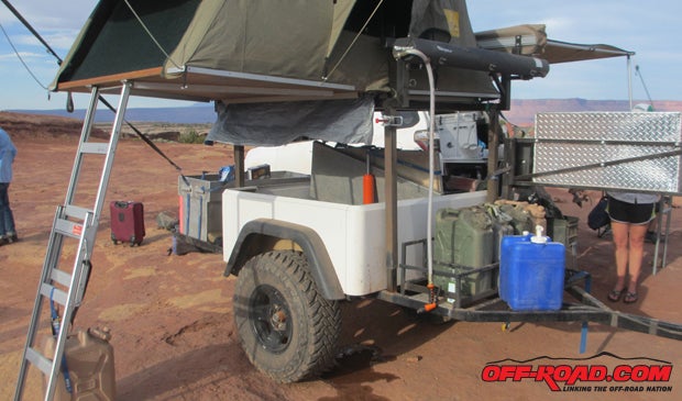 Using a telescoping rack, the Dinoot provides a platform for an Eezi-awn tent, as well as the Roadshower solar shower and sun awning.