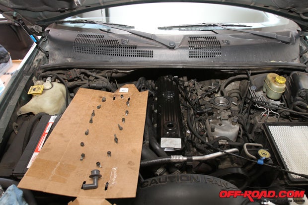 With our gasket set and our valve cover securely in place, it was time to install the bolts. Since we kept track of the each bolts position, it was easy to locate where each during reinstallation.