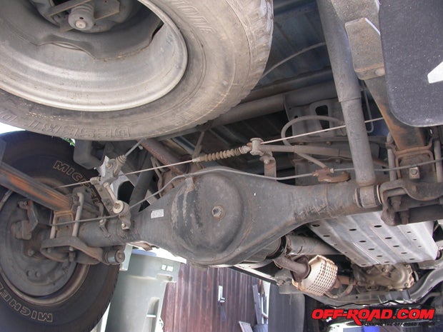 From the rear, you can see how the Toyota pickups eight-inch axle housing is relatively unadorned compared with the 4Runner version (not counting all the minor attachment points). The leaf spring mounts also contain the shock mounts.
