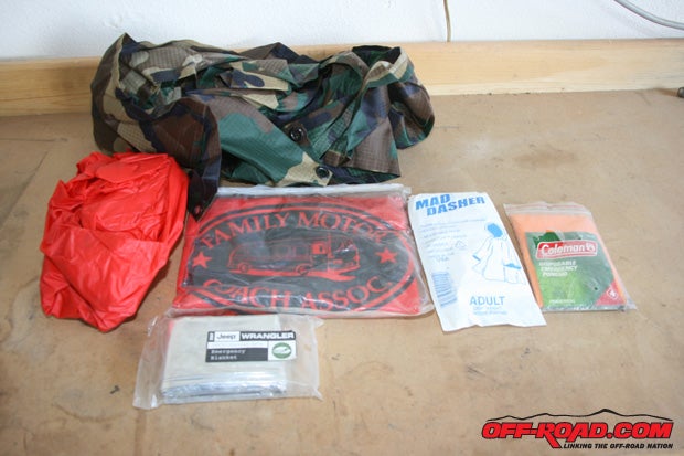 Heres some examples of what we carry in our bags: first aid kit, ponchos, MREs, toilet paper, spare gloves, Henry Arms AR7 .22 survival rifle, beef jerky, trail mix, perhaps even a spare set of clothes in case an accident happens.