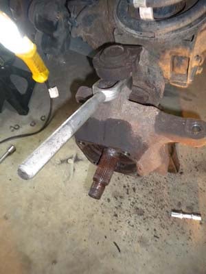 Put the pickle fork in between the knuckle and the axle housing and give it a few whacks with a large hammer. It should bust loose pretty easy.