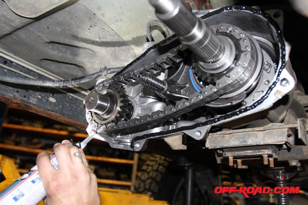 Before reinstalling the transfer case cover, the surface of the case mount was cleaned and a layer of silicone was put down to create a proper seal during reinstallation. Then, carefully install the cover onto the main output shaft, which can be the trickiest portion of reinstallation.
