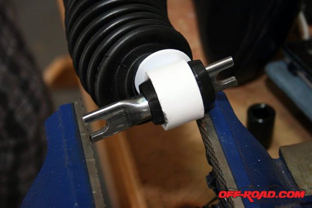 Install the bushings, sleeves and boots on the longer Daystar Scorpion shock absorbers.