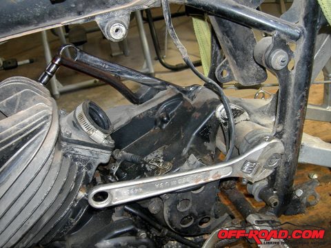 The swing arm pivot bolt can now be loosened.