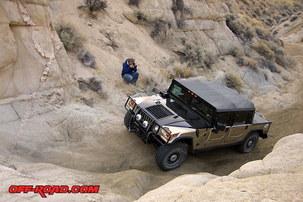 The H1 Alpha Hummer climbs up rocks without breaking traction. The BFG KOs did amazing under this heavy beast. Hall was able to air down from inside the vehicle using the CTIS and lock the differentials as needed for added traction control. (Photo Beth Hernandez)