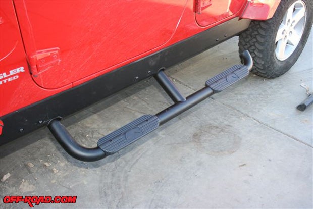 As you can see, each of the three mounting brackets is attached to the rocker panel protector with two Allen screws. If you forget to lift the Slider Step, its bungee cord will slide it back into its traveling position after a few bumps. Looks great and really eases the chore of getting in or out of a lifted Jeep