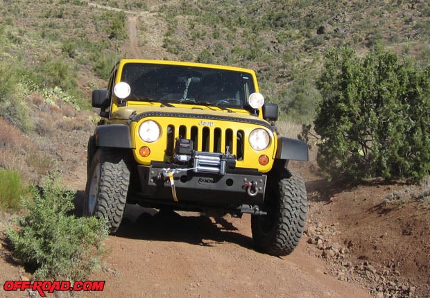 The Rancho JKrockGEAR bumper looks good, gives the tires more clearance in tough off-road situations, provides recovery attachment points, strongly supports the Superwinch, and protects the Jeep in mall parking lots and on rocky trails.