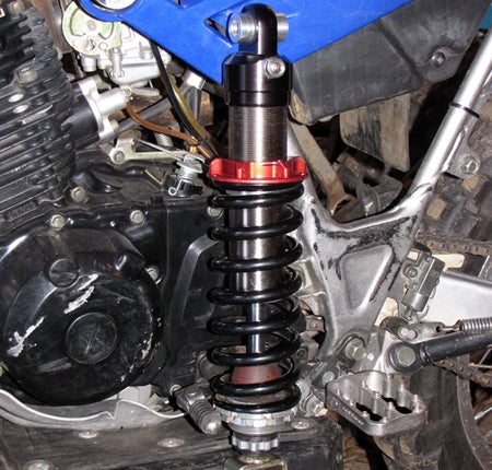 Cogent Dynamics builds their Moab shock to each customers personal specifications. Compared to the wimpy OEM shock this thing is beefy!