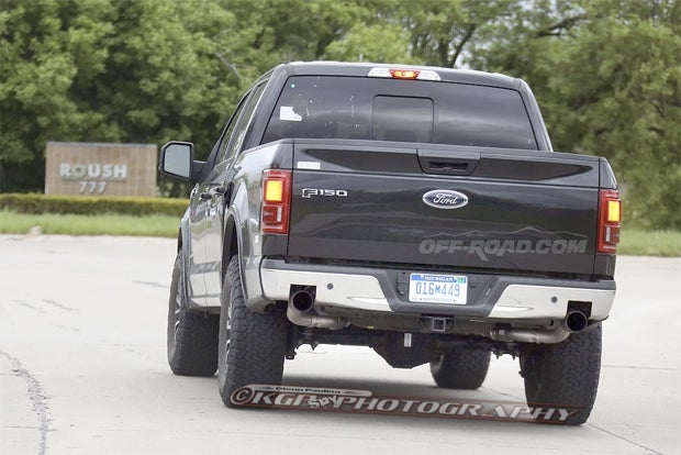 Why did we think this F-150 mule is an SVT test truck? Because it was caught pulling into the SVT/Roush shop entrance.