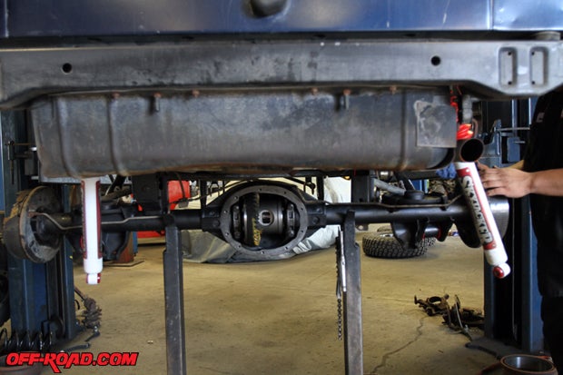 The rear axle is aligned and installed, as the suspension components are reattached as well as the driveline.