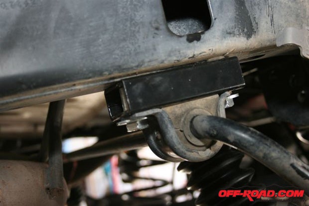 Install the rear sway bar drop-down bracket with the supplied hardware.