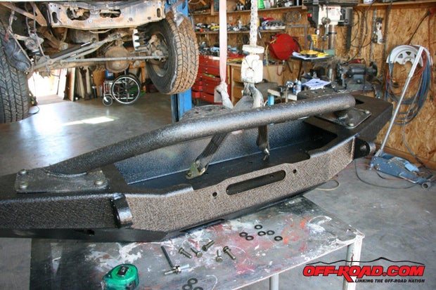 From previous experience, we mounted the bull bar to the front bumper prior to installing the bumper. Its much easier to assemble it when the bumper is not on the vehicle.