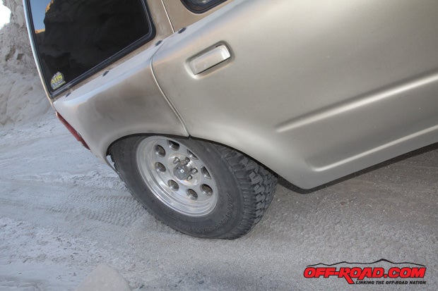 Hows this for bump travel? Custom fiberglass bedsides do a perfect job of enveloping the tire.