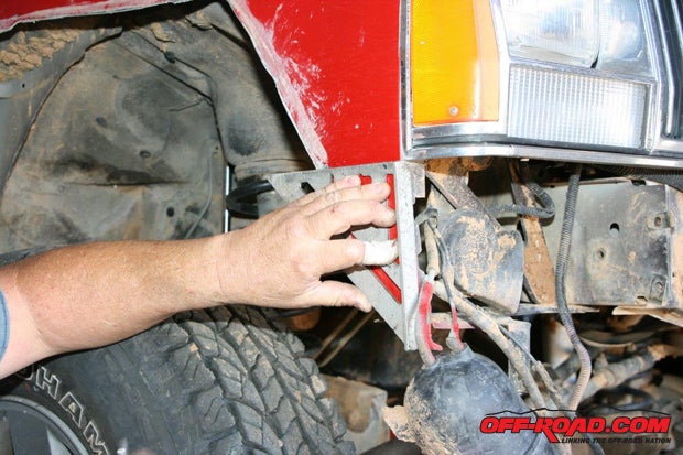 If you have a first generation Cherokee, you will need to cut the front fenders before you can install the bumper. Scribe a line on the fenders that is even and straight back from the grille, as shown here.