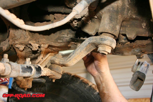Remove the three OEM steering box bolts. Be sure to support the steering box after unbolting it. Install the bumper mounting plate to the outside of the frame rail. Secure the steering box and mounting plate using the provided 7/16x4-inch bolts.