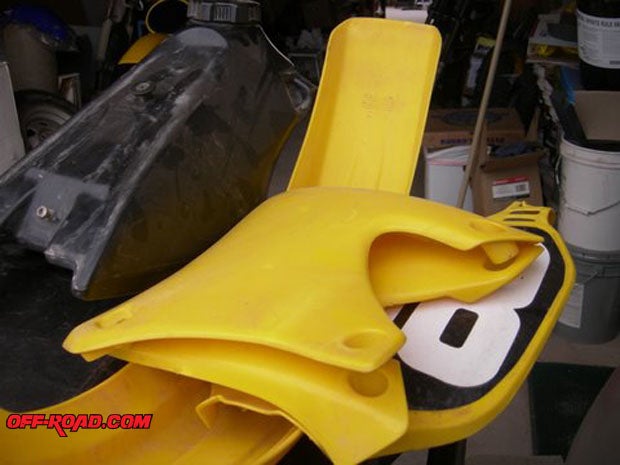 Luckily, we were able to get the Bob Hannah Hurricane kit for our bike instead of the normal blue plastic. Yep, its yellow and even the seat cover is yellow and black.  Should look good with our Suzuki motor.