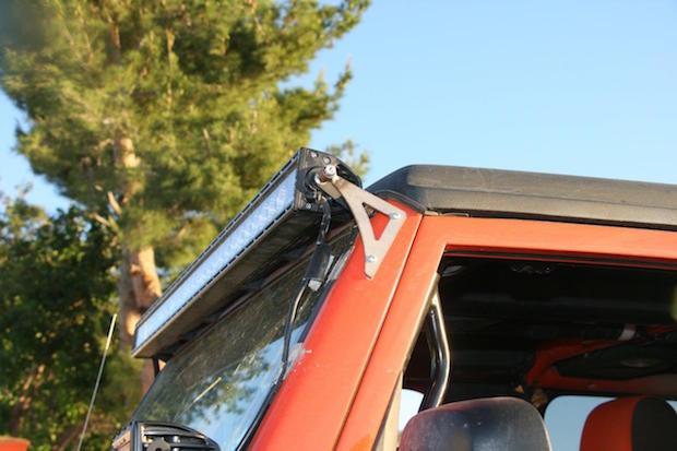 We added the triangle bracket to each side of the lightbar to aid in its support over the technical trails this Jeep is used on.