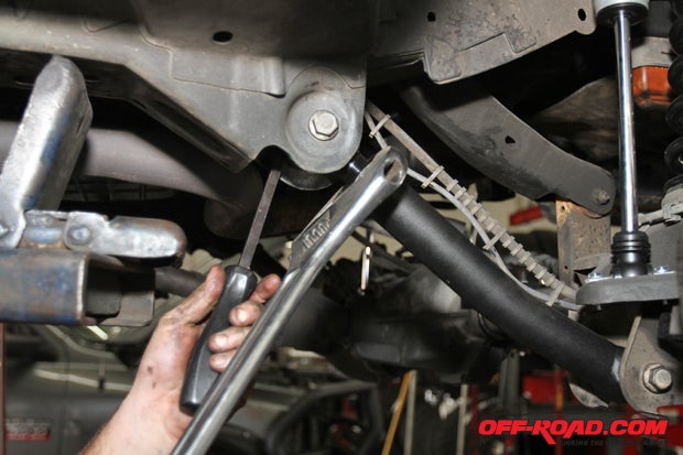 The adjustable front lower control arms get tightened into place before the Jeep comes off the lift. 