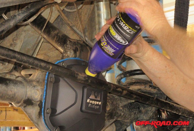 Using Royal Purple Max-Gear (75W-140W) synthetic gear oil, fill the differential until the fluid begins to seep out of the filler hole, then insert and tighten the dipstick bolt. Use Loctite on the dipstick bolt and the magnetic drain plug to keep them from backing out accidently.