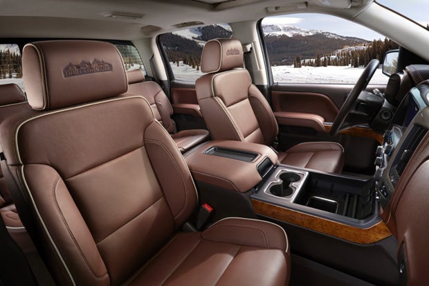 The interior of the 2014 Chevrolet Silverado High Country features an exclusive saddle brown interior. Features include heated and cooled perforated leather front bucket seats with High Country logos on the headrests, Chevrolet MyLink connectivity with an 8-inch touch screen, Bose premium audio and front and rear park assist (Photo General Motors).