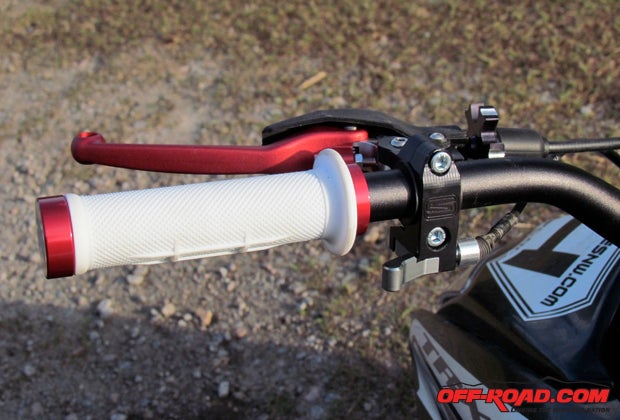 The billet clutch perch has a nylon bar sleeve to protect the bar and allow the perch to rotate in the event of a hard impact. It also has an optional hot start button.