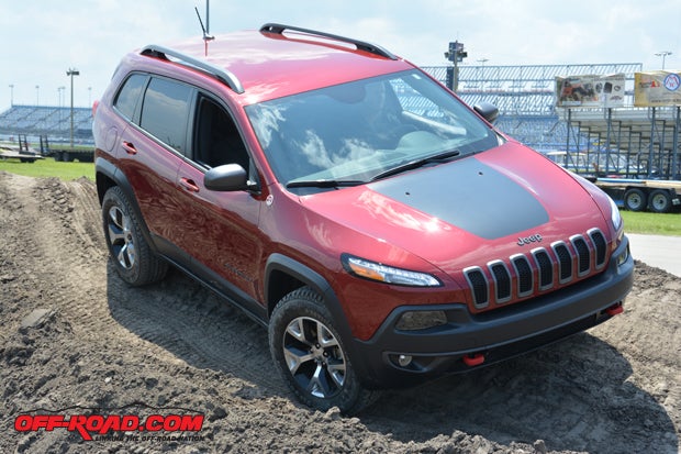 Stock 2014 Jeep Cherokee Trailhawk takes on the obstacle course.