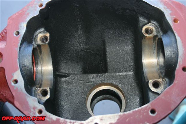 In an AMC Model 35 differential there are no return passages for the gear oil, which lubricates the axles and bearings so a channel will have to be ground into cast bearing housing.