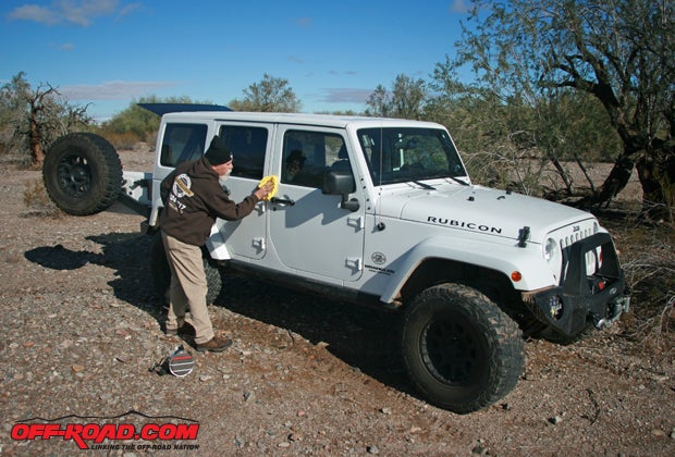 Always make sure the Jeep is clean before applying the magnetic panels. George Bernard is cleaning the last of dust from his Jeep.
