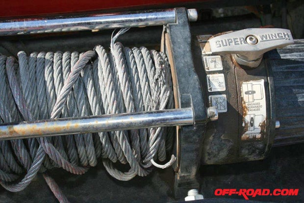 Broken cable strands can also grab adjacent cable and snag it while spooling in or out of the winch, so it either must be replaced or cut out.