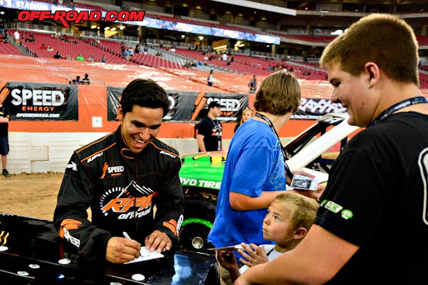 Laguna signs autographs at the meet and greet on the track prior to the race.
