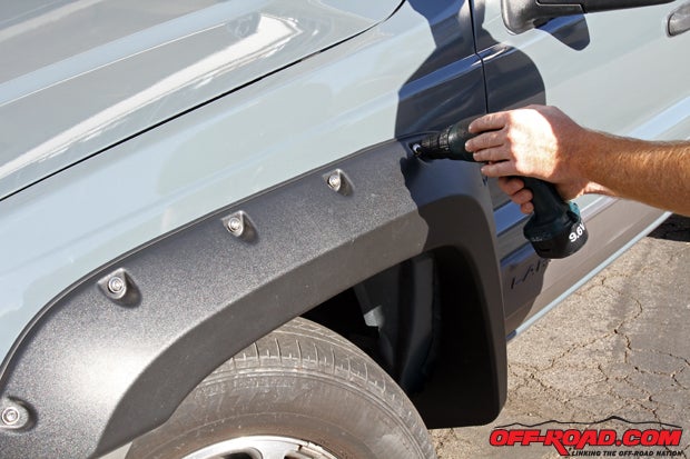 Its ideal to have an extra set of hands for the installation, as the fender will have the bolts and bushings already in place. Carefully line up the bolts with each hole and tighten them down until snug  but do not overtighten! The screws can then be tightened with a torque wrench to 24 in.-lb. (2 ft.-lb.).