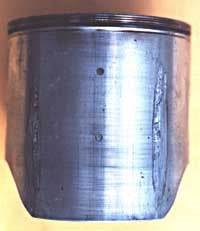 Seizure is caused when the piston expands faster than the cylinder and the clearance between the piston and cylinder is reduced.