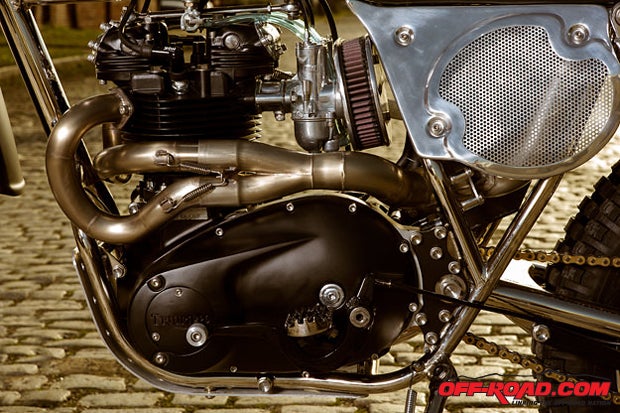 The shift side of the Atom Bomb Custom bike shows the tucked-in, hand-built exhaust system.