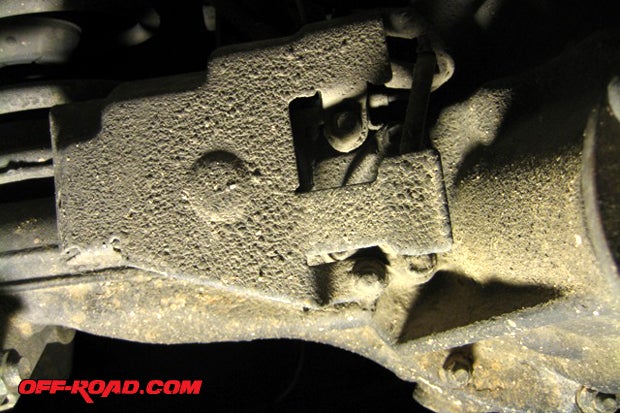 Remove factory E-Locker guard on rear differential by loosening bolts.