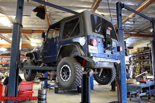 Our 2000 Wrangler is put on the lift to begin the front and rear axle work.