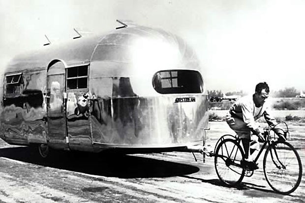 An Airstream being towed by bicycle (Circa 1947).