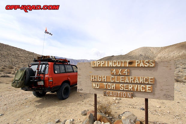 Lippincott Pass - 4x4 High Clearance. No Tow Service. Caution. The sign confirms the Lippincott trail near the southern end of the Racetrack playa is nothing to mess with--especially if you’re driving a minivan with the kids.