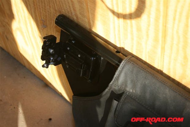 Make sure the latches are mounted on the rear doors with the catch facing upward.