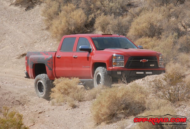 Weve driven stock Silverados through this same wash but Reapers extra shock travel is clearly apparent.